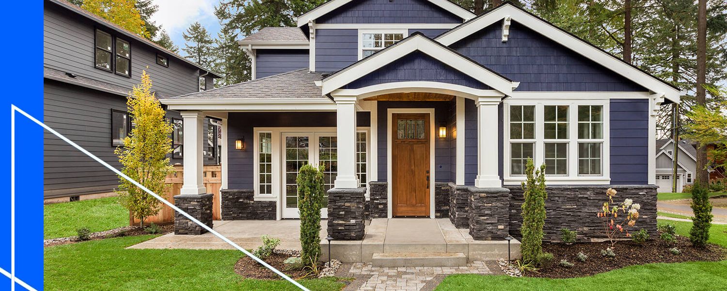 Front view of house with blue siding and white accents.