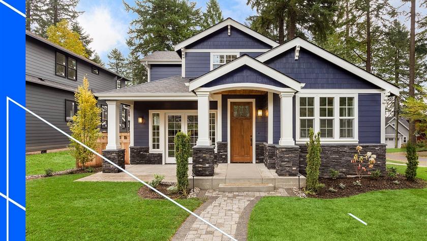 Front view of house with blue siding and white accents.